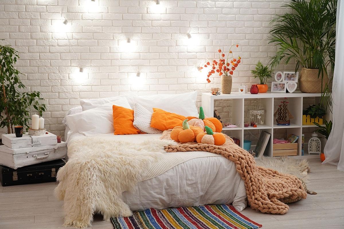 A photo of a bedroom decorated for fall.