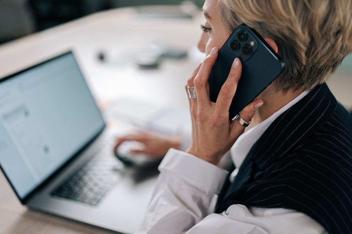 A renter on the phone expressing their interest in submitting an application.