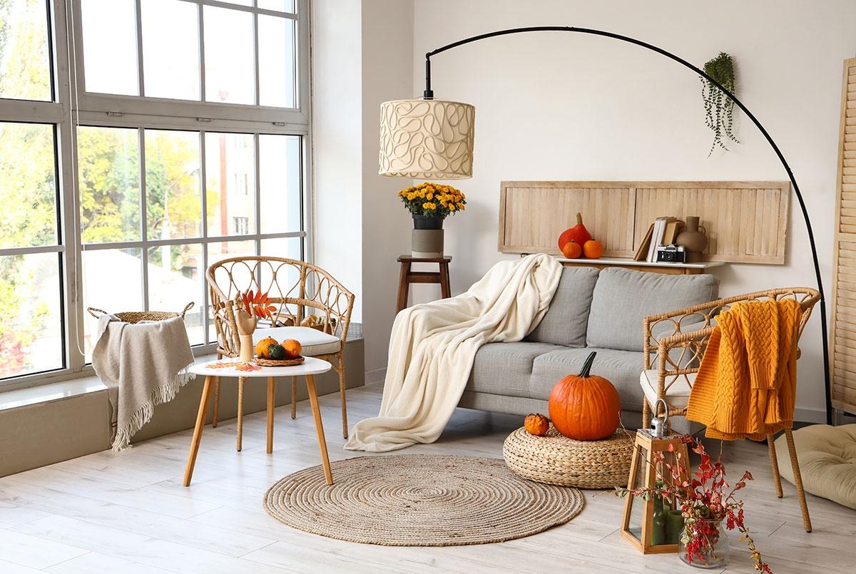 A photo of a living room decorated with fall decor.