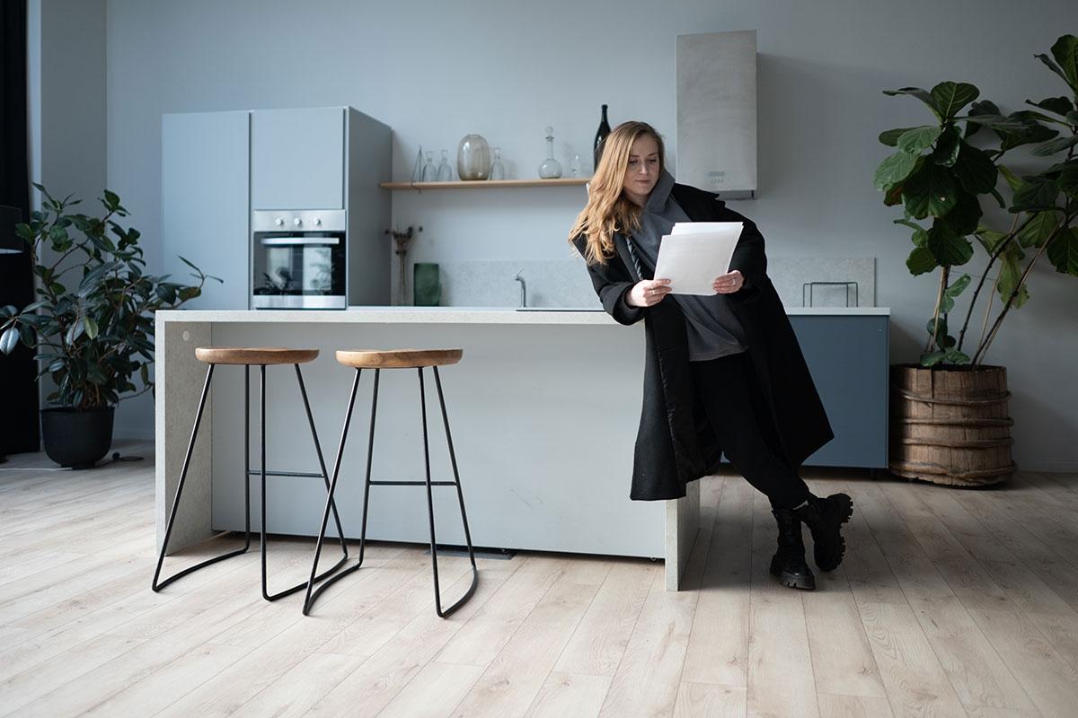 Renter reading over the lease requirements for a pied-a-terre.