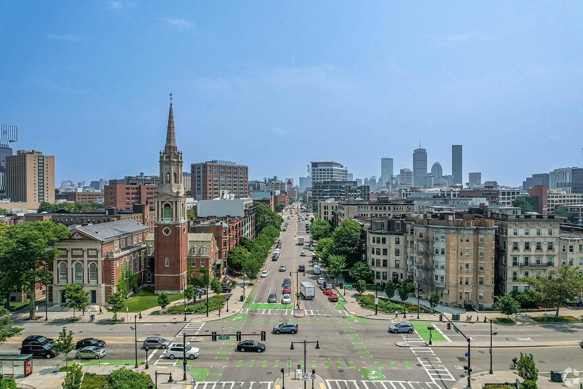 The grid-like layout of the streets of Boston break up the compact blocks that are filled with buildings.