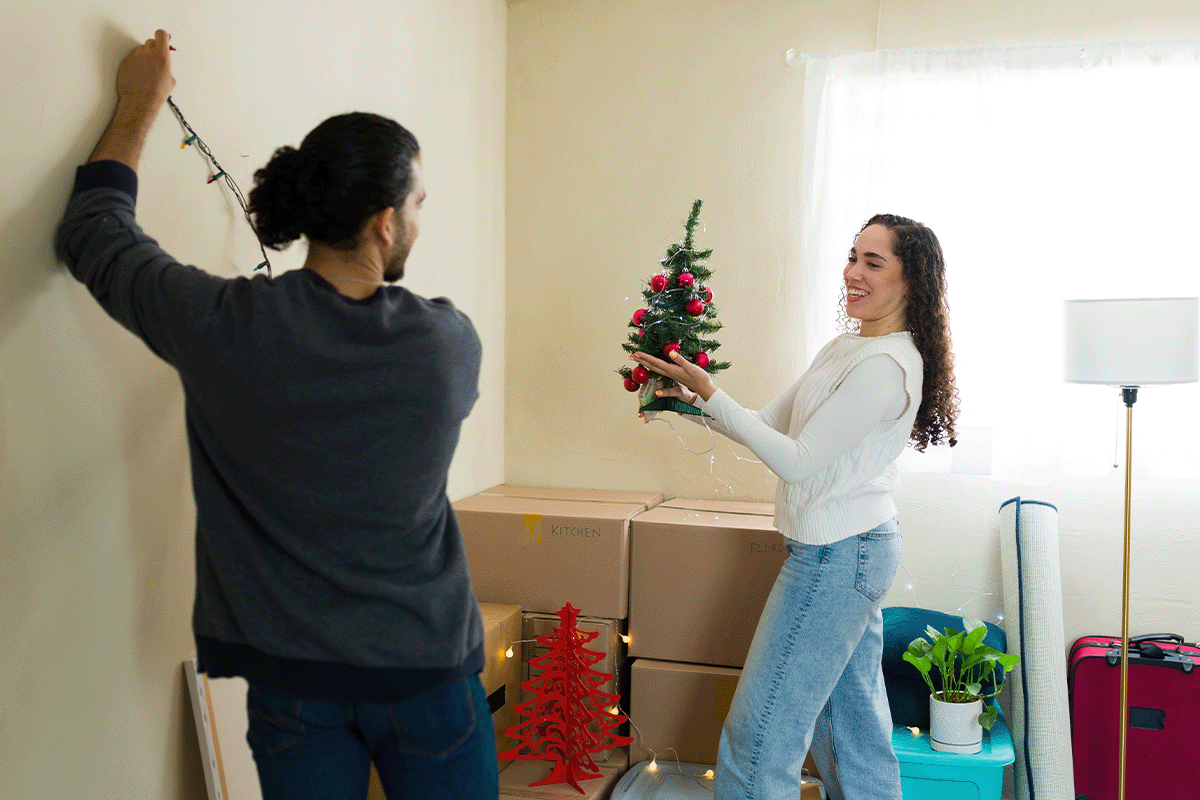 Couple decorating for Xmas after a move