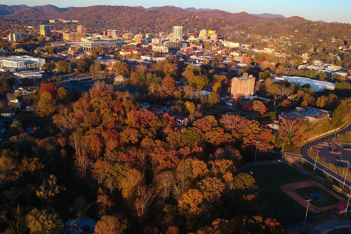 The many trees in Asheville turn red and orange in fall.