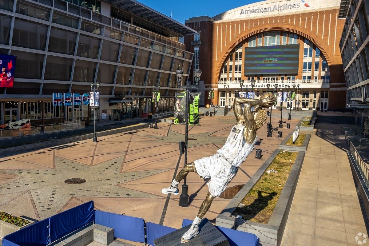 The walkway to the entrance of the American Airlines Center has basketball statues.