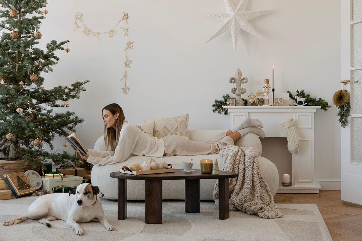 Renter laying on her couch enjoying her holiday decor.