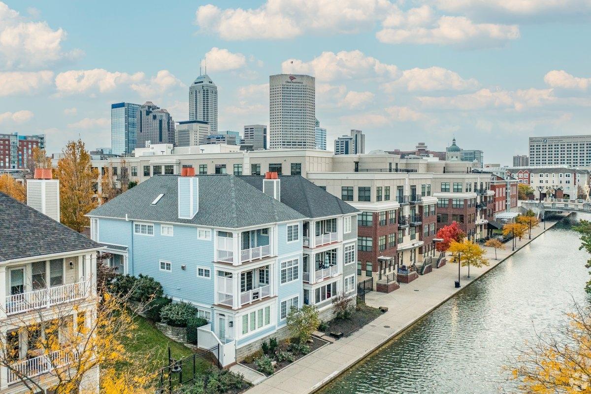 Homes and apartment communities sit right along the canal with a wide walkway between the two.