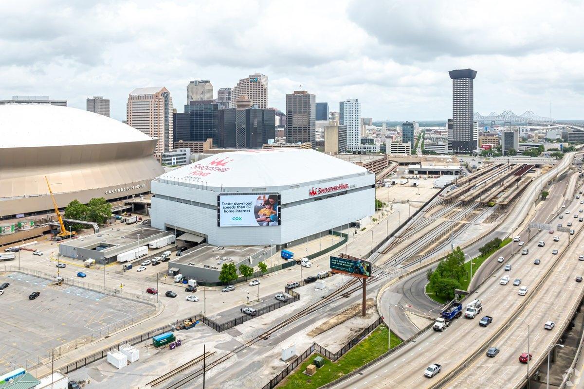 Smoothie King Center sits between the highway and Caesars Superdome.