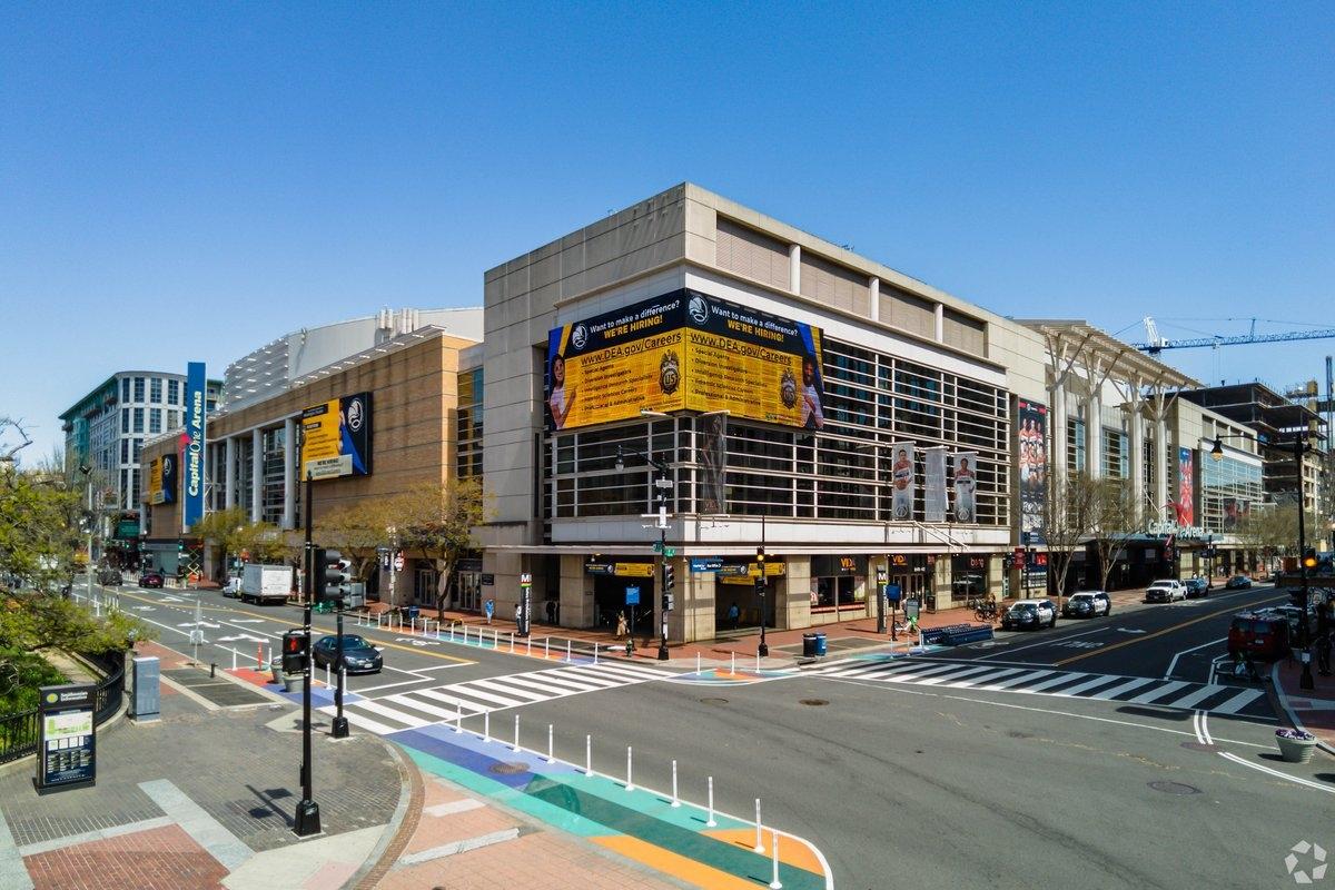 Capitol One Arena sits at the corner of a block.