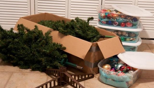 Boxes and bins filled with Christmas decorations.