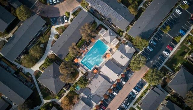 An aerial view of a neighborhood with pool