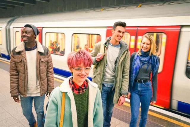 four college students getting off the metro