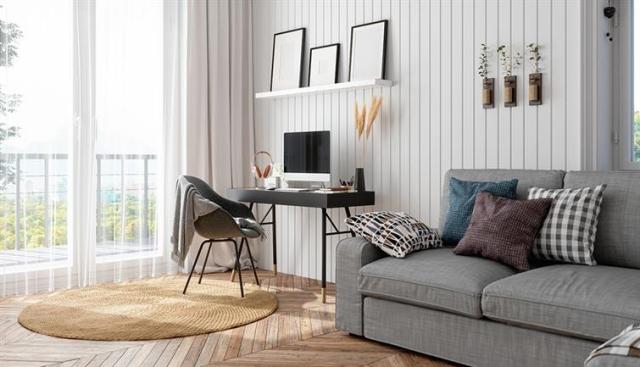 a living room with neutral furniture