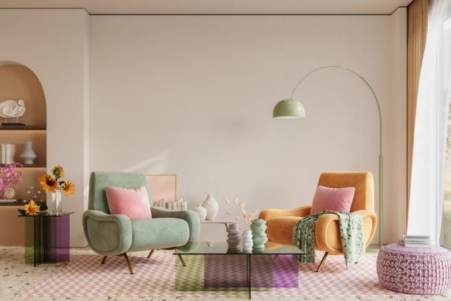 A colorful living room shows mismatched chairs on a chevron rug.