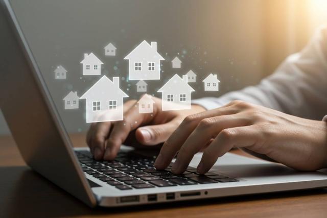 Man types on his laptop. 