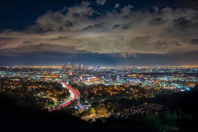 The lights of Los Angeles shine during the night.