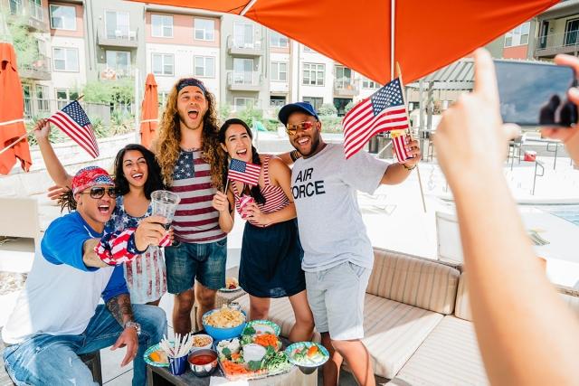 Group of friends celebrating the Fourth of July in their apartment complex.