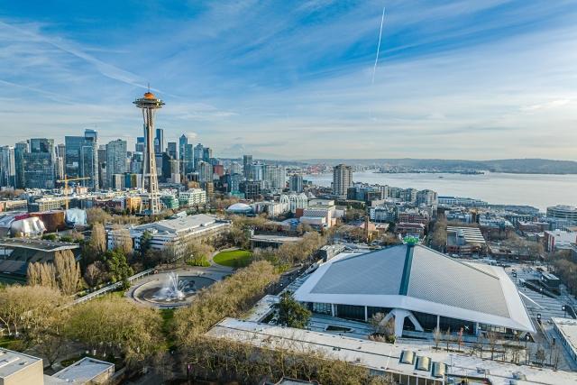 An aerial view of the Space Needle and Climate Pledge Arena in Lower Queen Anne.