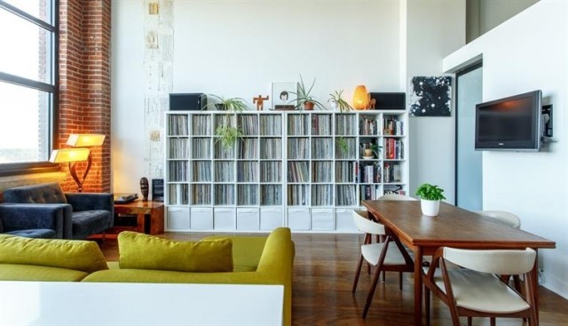 A small apartment with a large bookcase
