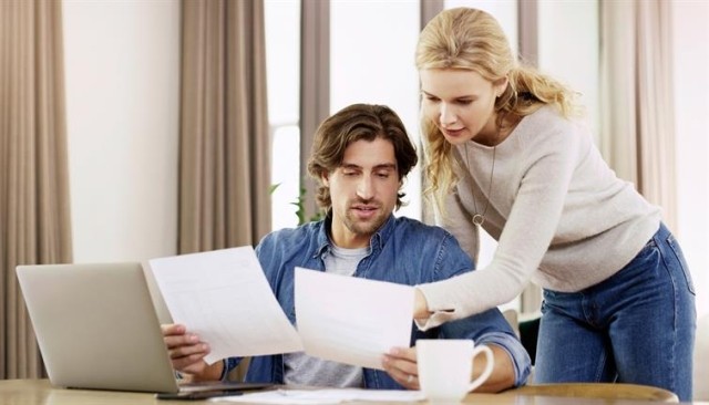 Two people discussing a lease agreement