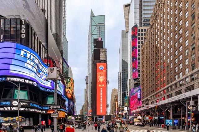 Billboards light up a bustling Times Square.