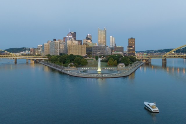 A view of Point State Park in Pittsburgh shows a boat cruising through the Ohio River. 