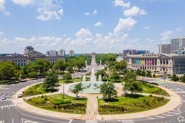 A view of Logan Square in Philadelphia shows the Swann Memorial Fountain and the Franklin Institute with the Philadelphia Museum of Art in the distance.