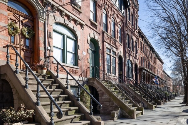Brownstone row houses in Downtown Jersey City give residents an urban feel.