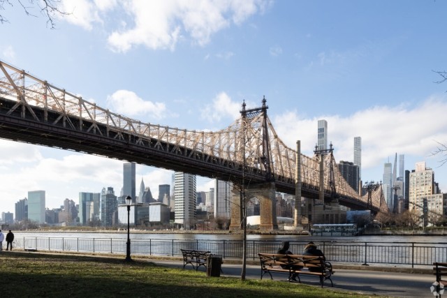 The Queensboro Bridge stretches across the East River and connects Queens to Manhattan.