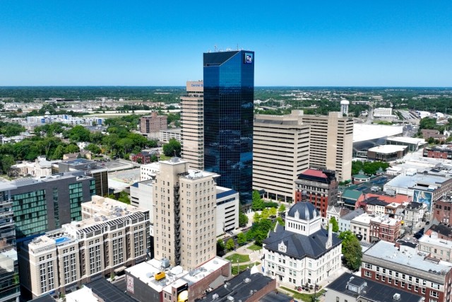 An aerial view of Downtown Lexington shows modern skyscrapers next to historic buildings.