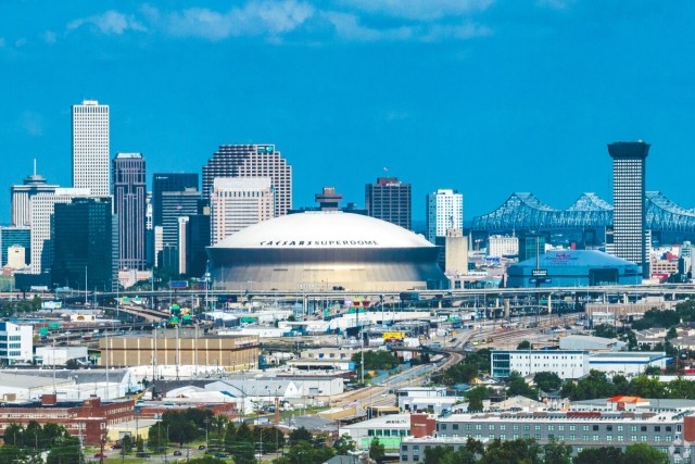 The New Orleans skyline sits behind Caesars Superdome, where the Eagles and Chiefs will play.