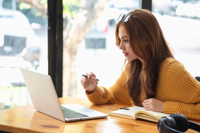 A person looking at a computer screen