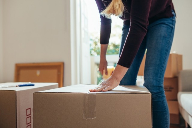 Woman packing boxes.