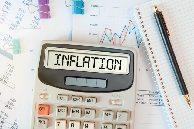 Calculator with the word, "inflation" on it.