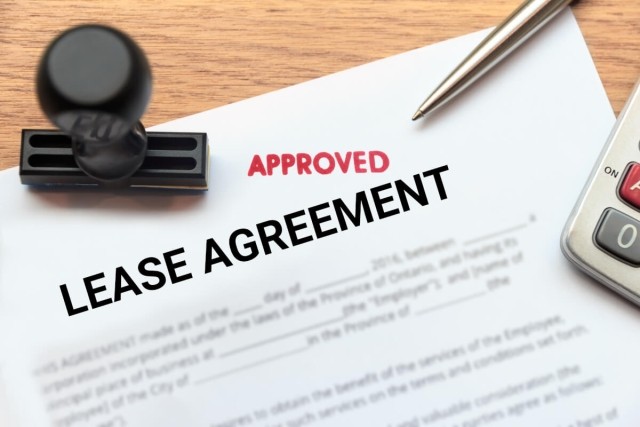 A lease agreement has been stamped "approved."