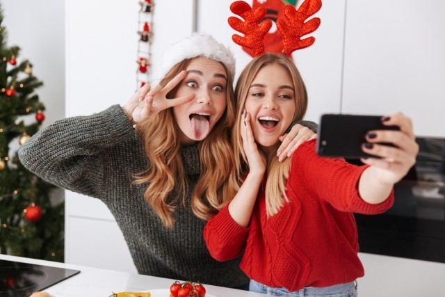 Best friends celebrating Christmas in a small apartment