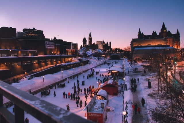 People skate on the Rideau Canal in Ottawa during the winter.