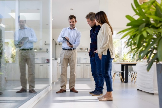 A tenant discusses and negotiates a lease with their landlord.