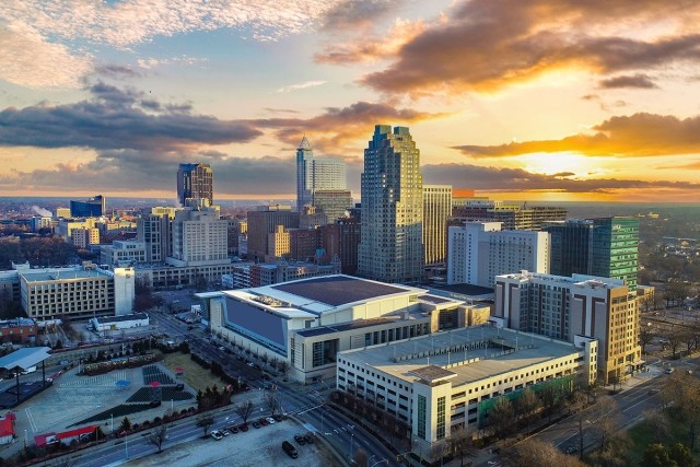 The skyline of Raleighs spreads out across the horizon during sunset.