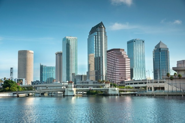 A waterview shot of the Tampa, FL skyline on a sunny day