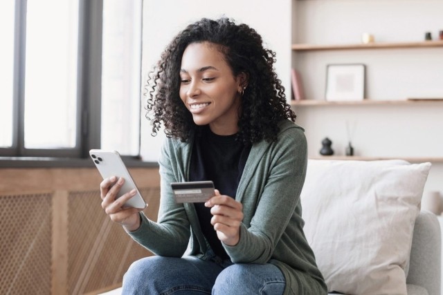 A renter making a payment using her cell phone.