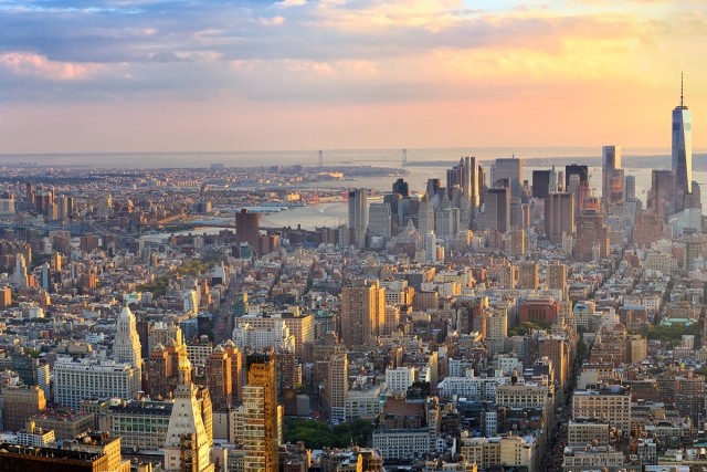 NYC stretches out below, full of buildings.