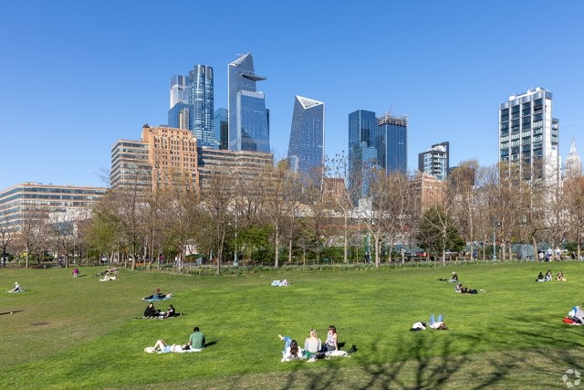 New Yorkers enjoy the sun at a park in Chelsea.