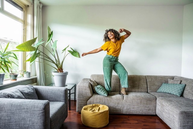 Woman alone in her one-bedroom apartment. 